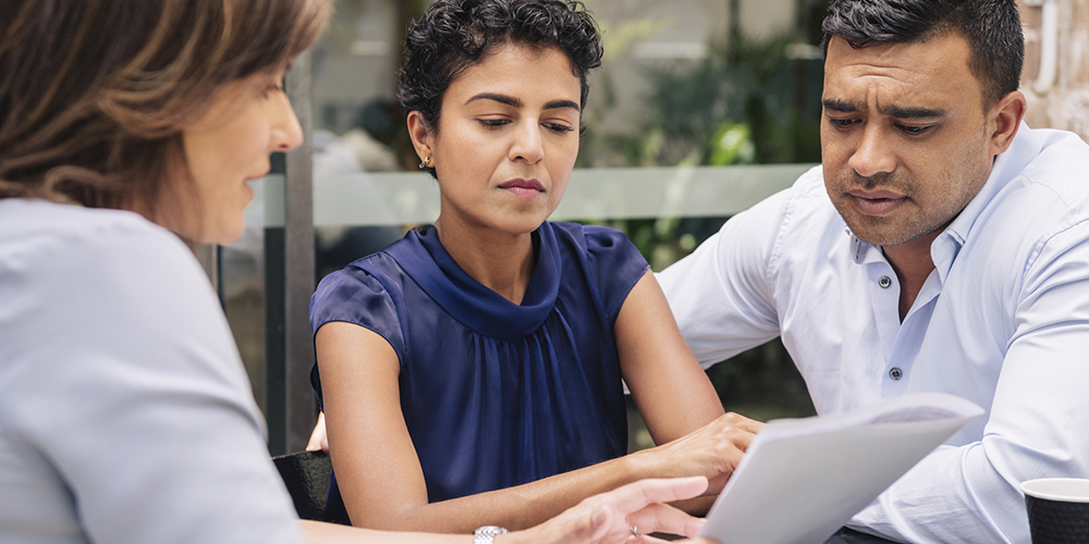 Serious couple receive professional advice