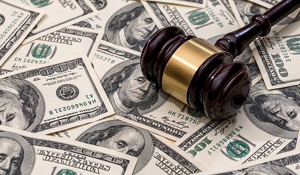 wooden hammer on dollar. close up